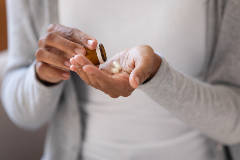 woman taking daily supplements